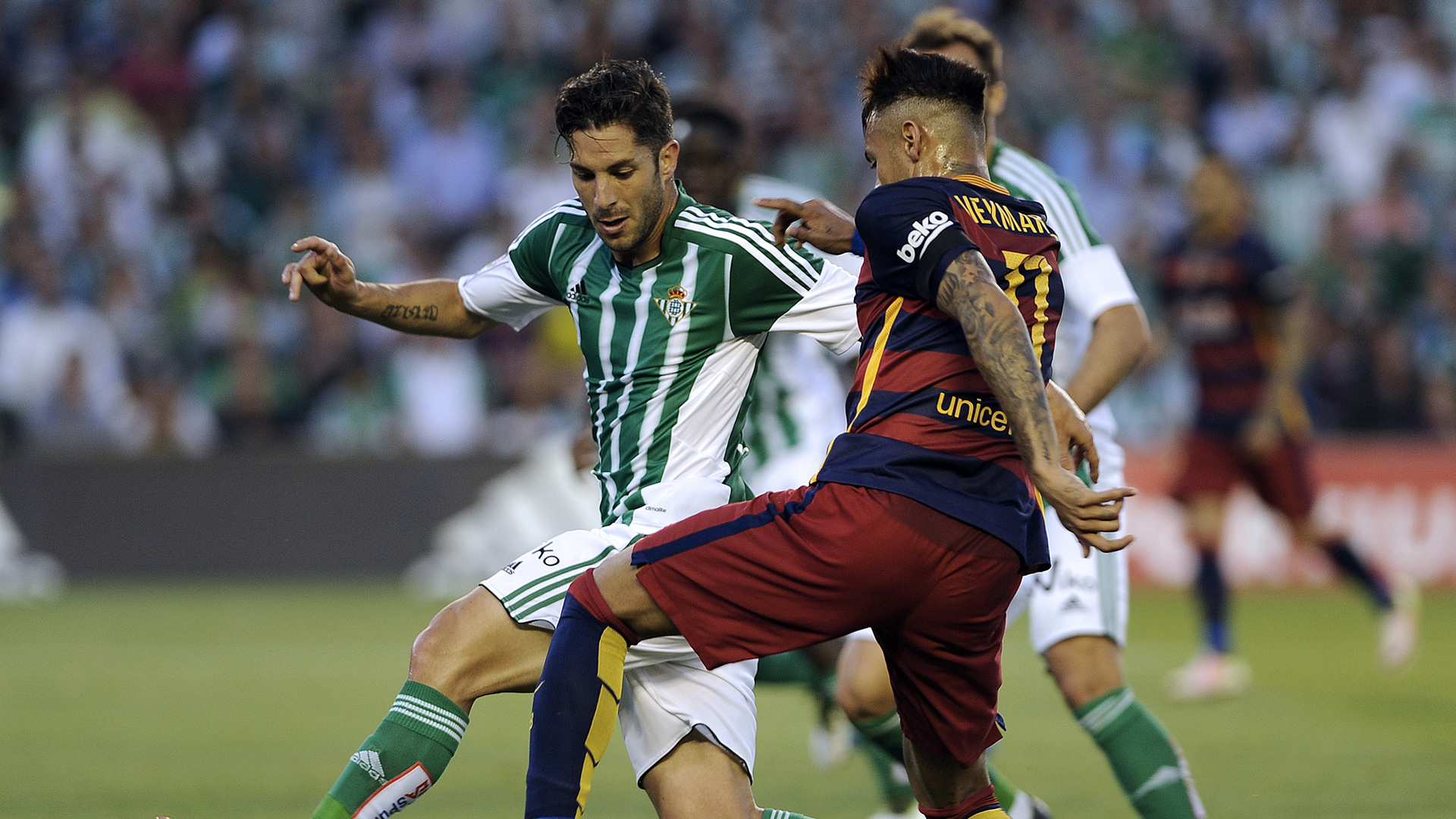 Barcelona's Brazilian forward Neymar (R) vies with Betis' midfielder Alvaro Cejudo (L) during the Spanish league football match Real Betis Balompie vs FC Barcelona at the Benito Villamarin stadium in Sevilla on April 30, 2016. / AFP / CRISTINA QUICLER        (Photo credit should read CRISTINA QUICLER/AFP/Getty Images)
